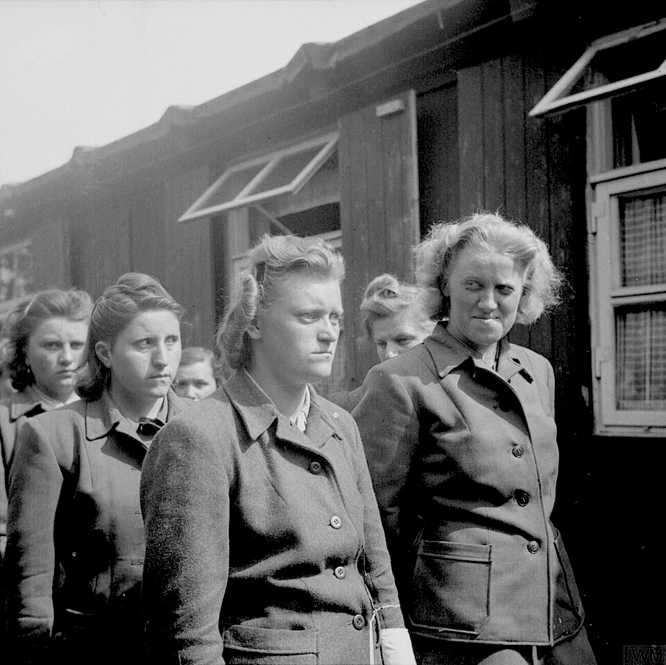Female concentration camp guards under arrest at Belsen, 1945